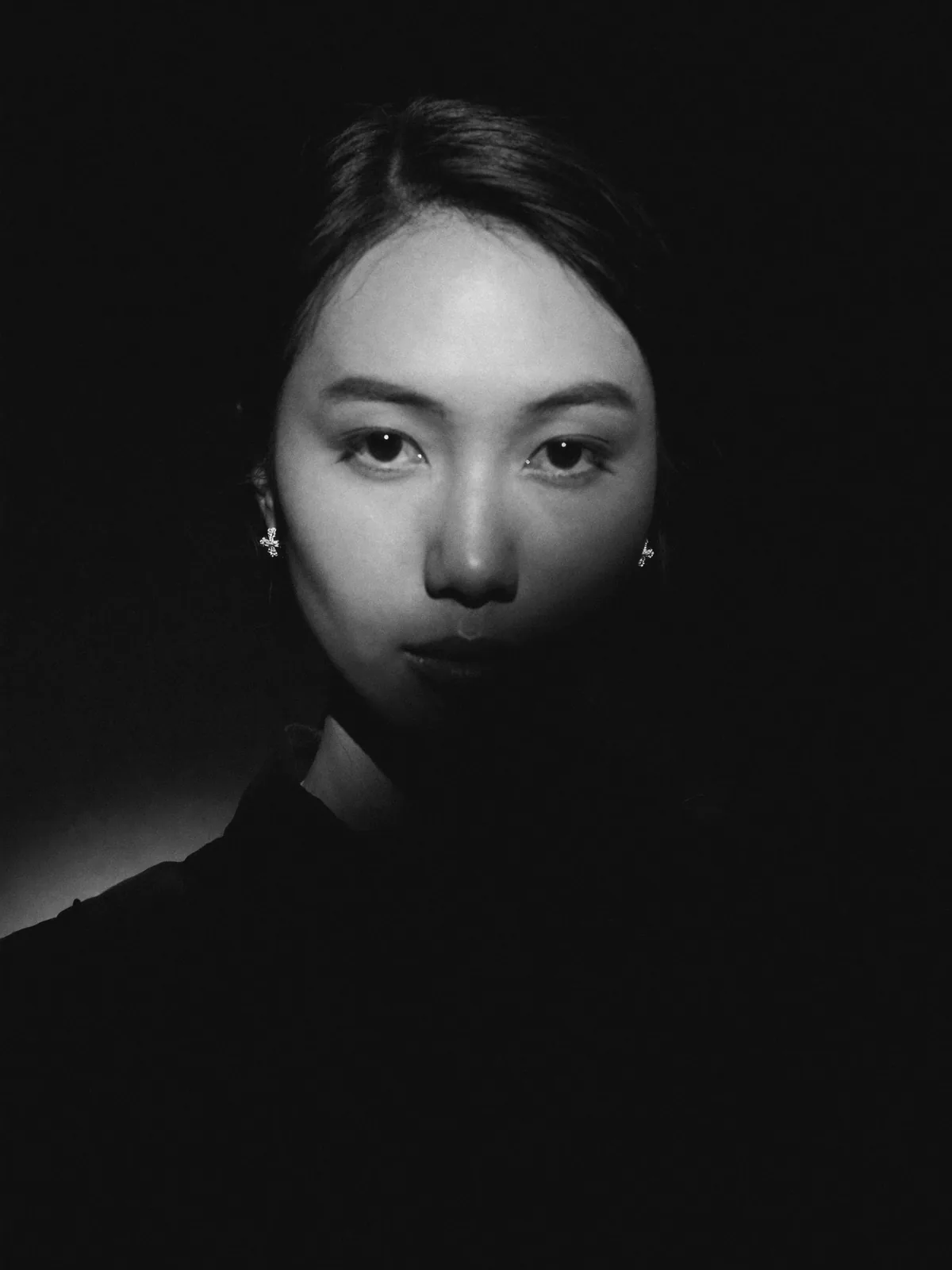 Chiaroscuro close-up, silver drop earrings