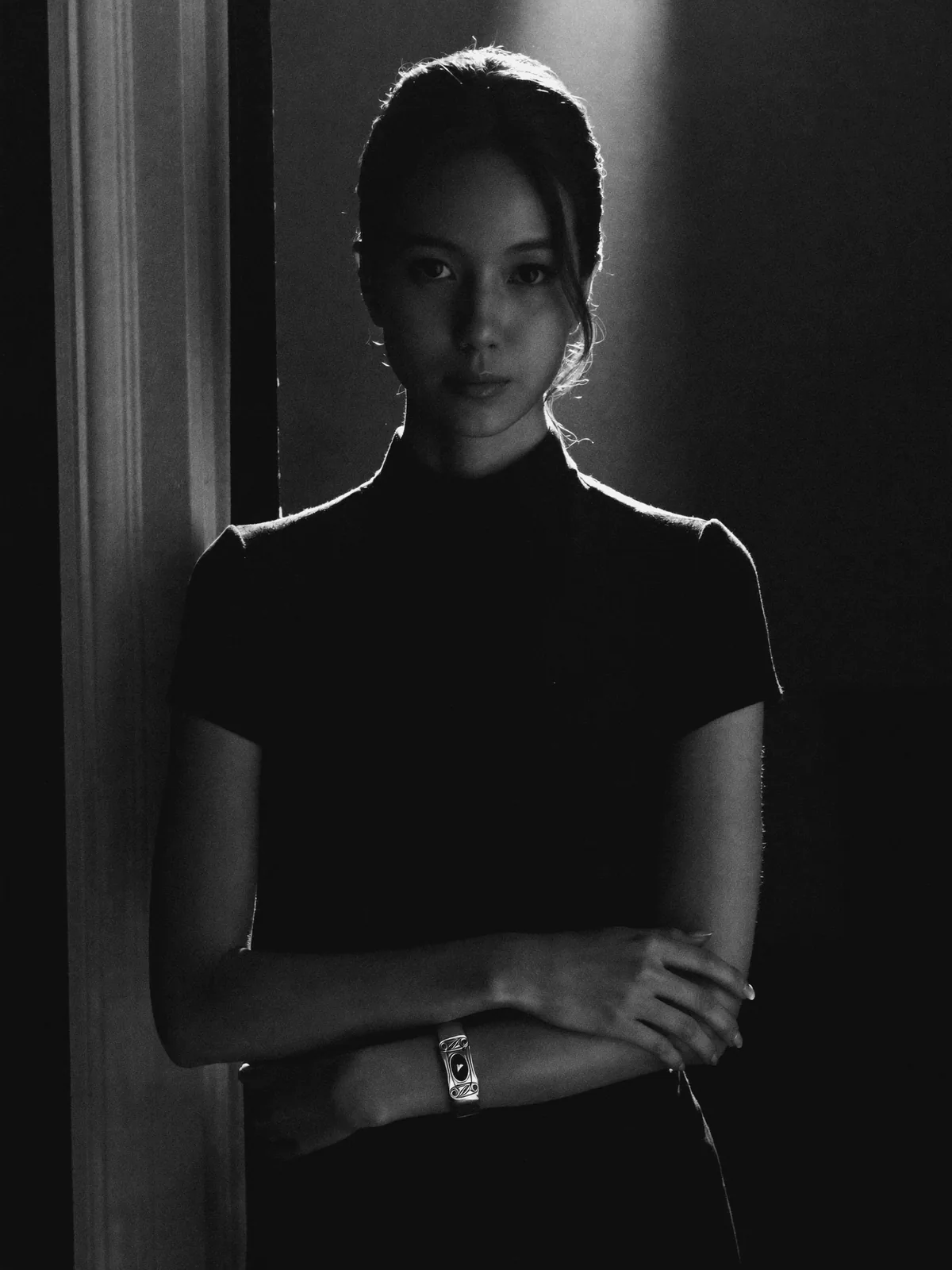 Noir backlit silhouette, silver cuff